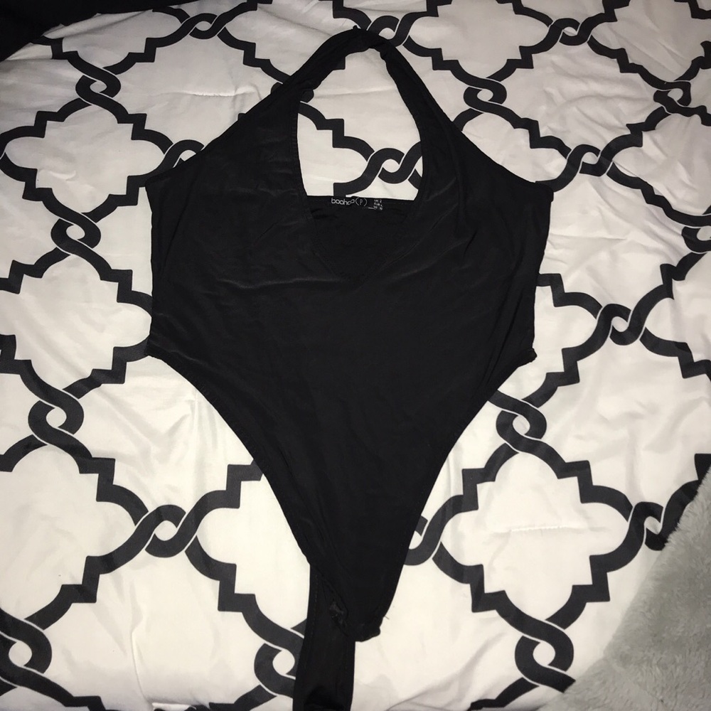 Deep V-neck cut , halter body suit